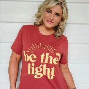 Be The Light Tee! Inspire others and wear this tee dressed up or down.